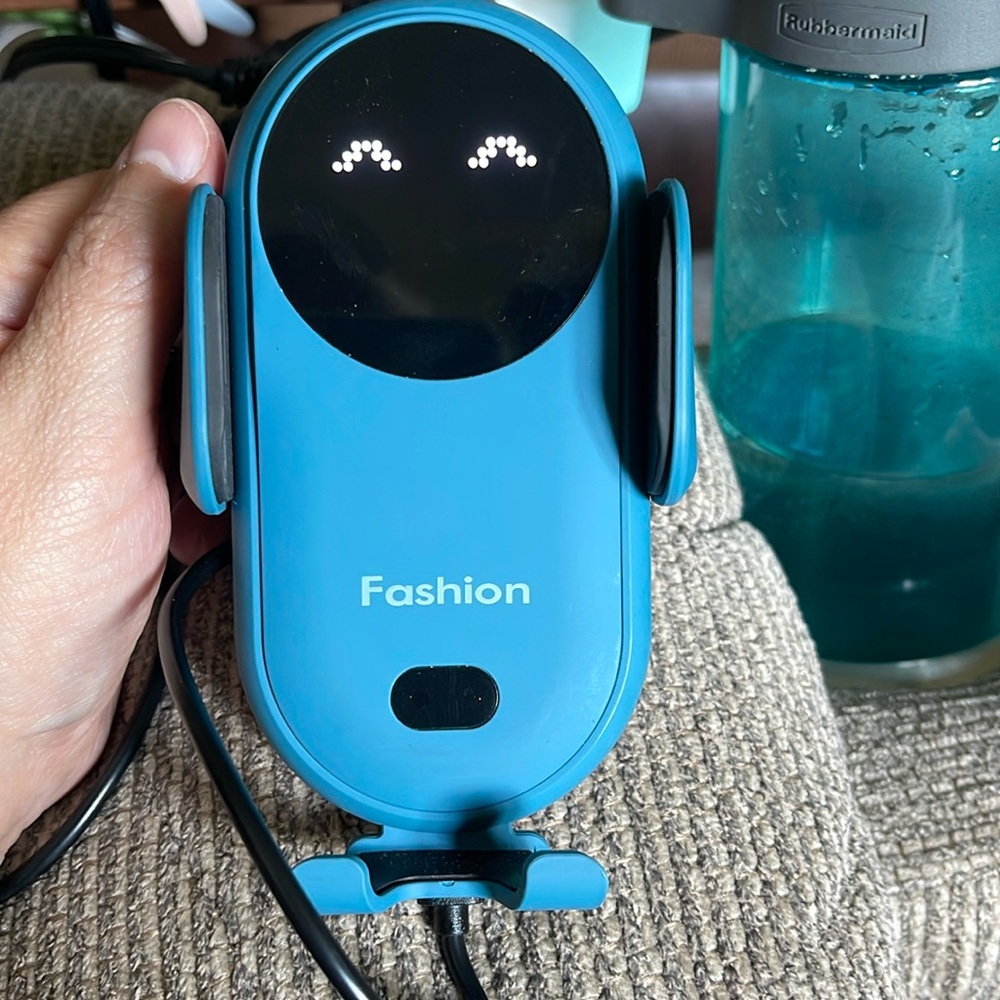 Cellular holder for car. Charges your phone when plugged in. Cord included.